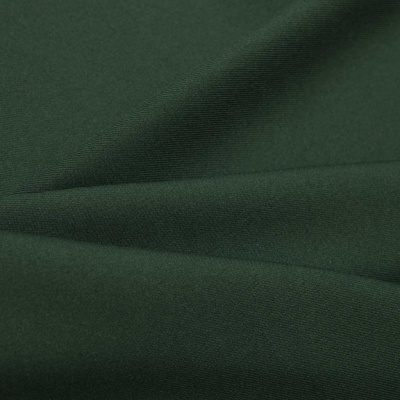 Ткань костюмная 21010 2076, 225 гр/м2, шир.150см, цвет т.зеленый - купить в Иркутске. Цена 390.73 руб.
